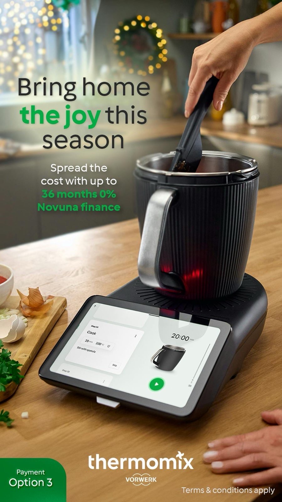 Thermomix TM7 on a wooden worktop with Novuna finance option on the screen